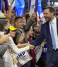 Republican vice presidential candidate Sen. JD Vance greets delegates as he arrives on the floor during the first day of the 2024 Republican National Convention at the Fiserv Forum, July 15, 2024, in Milwaukee.
Mandatory Credit:	Carolyn Kaster/AP via CNN Newsource