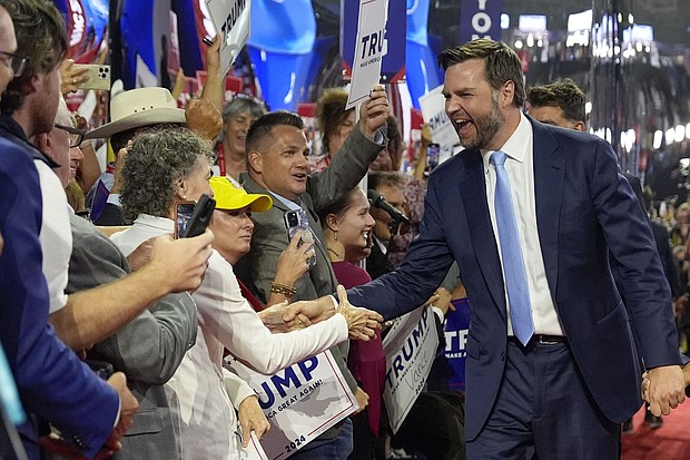 Republican vice presidential candidate Sen. JD Vance greets delegates as he arrives on the floor during the first day of the 2024 Republican National Convention at the Fiserv Forum, July 15, 2024, in Milwaukee.
Mandatory Credit:	Carolyn Kaster/AP via CNN Newsource