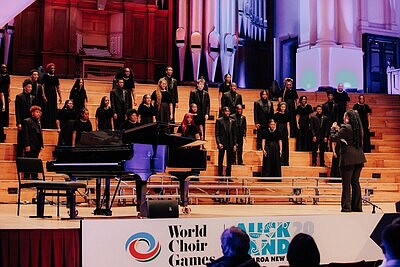 The Atlanta Music Project Senior Youth Choir under the direction of B.E. Boykin performs its competition set at the 2024 World Choir Games in Auckland, New Zealand. From July 11, 2024. Photo by Chontalle Musson.