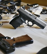 Confiscated guns are stored in the Hennepin County Sheriff’s Office in February 2015, in Minneapolis.
Mandatory Credit:	Jerry Holt/Star Tribune/Getty Images via CNN Newsource