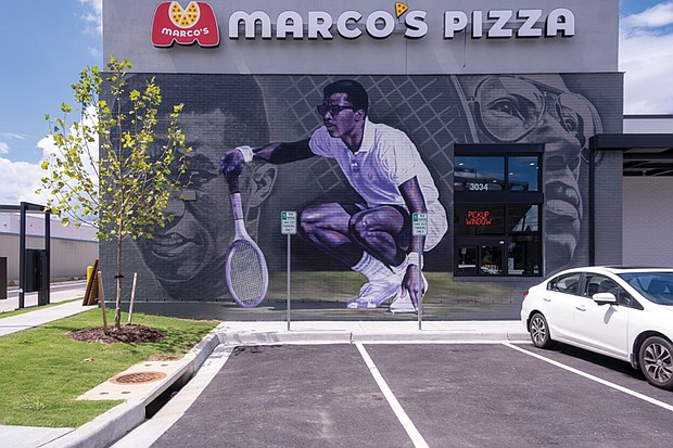 A new Arthur Ashe mural by local artist Jason Ford graces the front of Marco’s Pizza on Arthur Ashe Boulevard in Scott’s Center in Scott’s Addition. The late tennis great and humanitarian would have celebrated his 81st birthday last week.