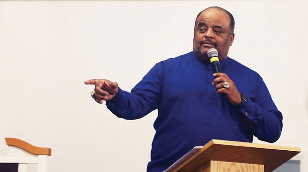 Journalist and author Roland Martin, addresses the audience during a town hall meeting on education reform in Richmond at Sixth Baptist Church on Sunday, July 14.