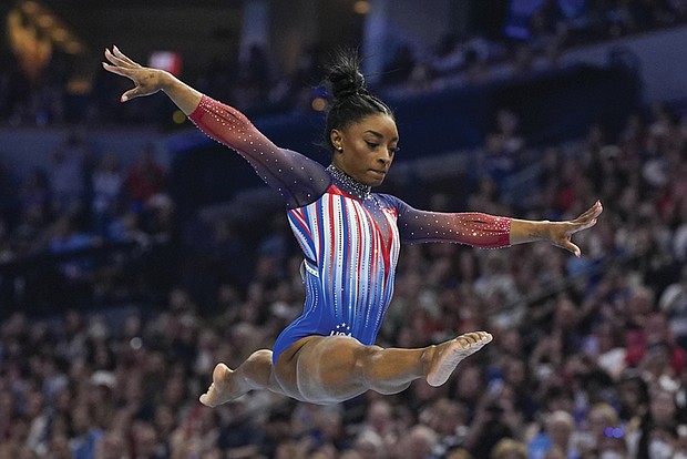 Simone Biles competes on the uneven bars at the United States Gymnastics Olympic Trials on June 30 in Minneapolis.