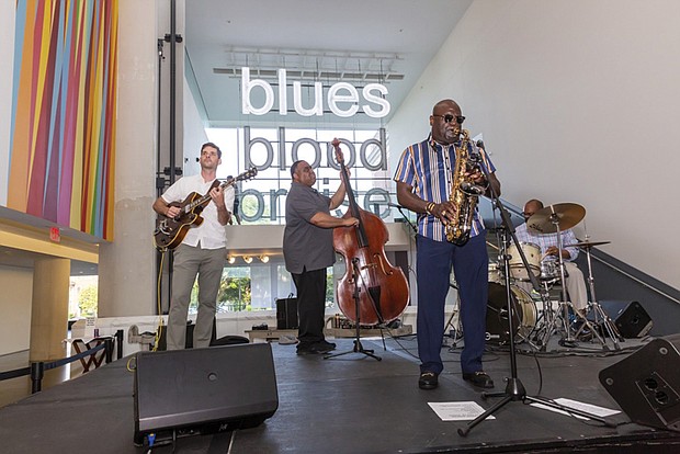 James "Saxsmo" Gates, right, at a recent performance at the Virginia Museum of Fine Arts.