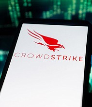 In this photo illustration a Crowdstrike logo seen displayed on a smartphone. The global computer outage affecting airports, banks and other businesses appears to stem at least partly from a software update issued by major US cybersecurity firm CrowdStrike, experts told CNN.
Mandatory Credit:	Mateusz Slodkowski/SOPA Images/LightRocket/Getty Images via CNN Newsource