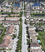 The vast majority of current renters in the US say they would like to buy a home – but can’t afford one. In an aerial view, homes sit on lots in a residential neighborhood on March 15, 2024, in Miami, Florida.
Mandatory Credit:	Joe Raedle/Getty Images via CNN Newsource