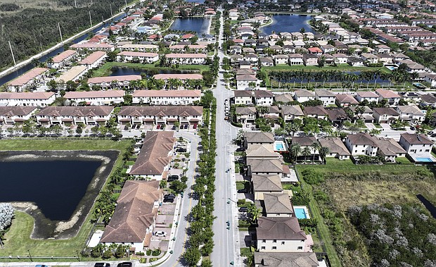 The vast majority of current renters in the US say they would like to buy a home – but can’t afford one. In an aerial view, homes sit on lots in a residential neighborhood on March 15, 2024, in Miami, Florida.
Mandatory Credit:	Joe Raedle/Getty Images via CNN Newsource