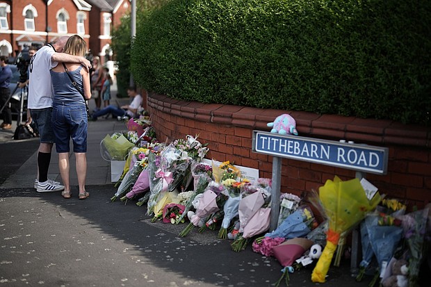 Tributes to the victims are left by wellwishers on July 30, in Southport, England after a teenager armed with a knife attacked children at a Taylor Swift-themed holiday club in Hart Lane, Southport.
Mandatory Credit:	Christopher Furlong/Getty Images via CNN Newsource