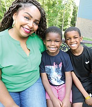 Seven-year-old Cayden Addison of Chesapeake, center, has been searching for a bone marrow donor for over a year. Seen here with his mother, Courtney Addison, and his big brother, Christian, he is the focus of a donor drive being held at the 804 Day music festival Aug. 2.