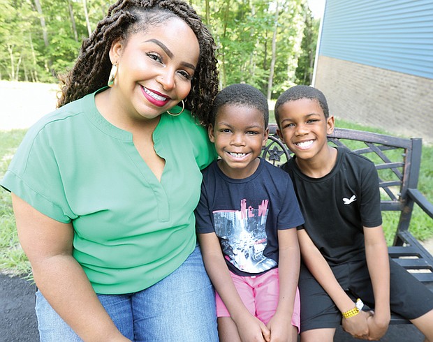 Seven-year-old Cayden Addison of Chesapeake, center, has been searching for a bone marrow donor for over a year. Seen here with his mother, Courtney Addison, and his big brother, Christian, he is the focus of a donor drive being held at the 804 Day music festival Aug. 2.