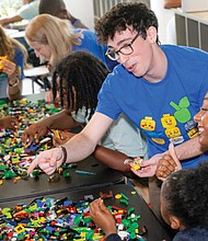 Lego Masters television show alum Ben Edlavitch leads a building session at the Boys & Girls Clubs of Metro Richmond Club in North Side. The goal of the session was to “envision a sustainable future through play-based learning,” according to a press release.