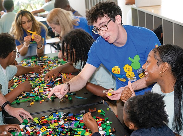 Lego Masters television show alum Ben Edlavitch leads a building session at the Boys & Girls Clubs of Metro Richmond Club in North Side. The goal of the session was to “envision a sustainable future through play-based learning,” according to a press release.