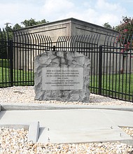 A stone bench that sat near a burial marker to Confederate soldiers at a utility substation is now gone.
