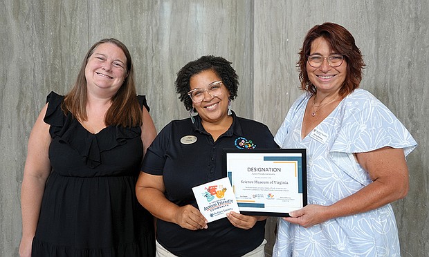 Autism Society of Central Virginia Executive Director Ann Flippin, left, Science Museum Community Engagement Coordinator Cherita Paul and Autism Society of Central Virginia Community Engagement Director Debra Holloway.