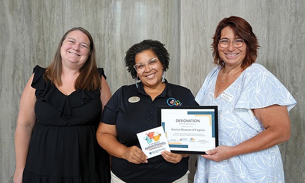 Autism Society of Central Virginia Executive Director Ann Flippin, left, Science Museum Community Engagement Coordinator Cherita Paul and Autism Society of Central Virginia Community Engagement Director Debra Holloway.
