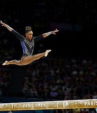 Rebeca Andrade of Brazil is pictured in action on the Balance Beam.
Mandatory Credit:	Hannah McKay/Reuters via CNN Newsource