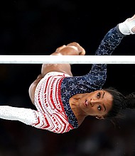 Simone Biles competes on the uneven bars in the women's team final at the Paris Olympics.
Mandatory Credit:	Jamie Squire/Getty Images via CNN Newsource
