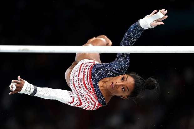 Simone Biles competes on the uneven bars in the women's team final at the Paris Olympics.
Mandatory Credit:	Jamie Squire/Getty Images via CNN Newsource