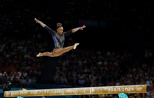 Rebeca Andrade of Brazil is pictured in action on the Balance Beam.
Mandatory Credit:	Hannah McKay/Reuters via CNN Newsource