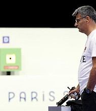 Turkey's Yusuf Dikeç competes in the 10m air pistol mixed team gold medal match during at Chateauroux Shooting Centre on July 30.
Mandatory Credit:	Alain Jocard/AFP/Getty Images via CNN Newsource