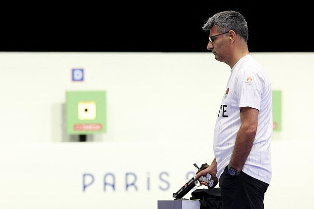 Turkey's Yusuf Dikeç competes in the 10m air pistol mixed team gold medal match during at Chateauroux Shooting Centre on July 30.
Mandatory Credit:	Alain Jocard/AFP/Getty Images via CNN Newsource