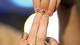 Jeremy Goupille shows his nails painted with the rainbow colors and the Olympic rings at the opening of Pride House, the safe space for the LGBT+ community of athletes, during the 2024 Summer Olympics.