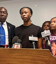 Malachi Hill Massey, 17, center, speaks at a news conference, July 23 at the NAACP headquarters in Springfield, Ill., about his mother, Sonya Massey, who was shot to death by a Sangamon County sheriff’s deputy July 6 in Springfield after calling 911 for help. On the left is civil rights attorney Ben Crump, who is representing the Massey family. On the right is Sonya Massey’s daughter, Jeanette Summer Massey, 15.