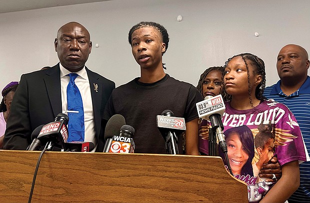 Malachi Hill Massey, 17, center, speaks at a news conference, July 23 at the NAACP headquarters in Springfield, Ill., about his mother, Sonya Massey, who was shot to death by a Sangamon County sheriff’s deputy July 6 in Springfield after calling 911 for help. On the left is civil rights attorney Ben Crump, who is representing the Massey family. On the right is Sonya Massey’s daughter, Jeanette Summer Massey, 15.