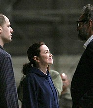 Evan Gershkovich and Alsu Kurmasheva speak with Special Presidential Envoy for Hostage Affairs Roger Carstens at Kelly Field in San Antonio, Texas, August 2, 2024.
Mandatory Credit:	Kaylee Greenlee Beal/Reuters via CNN Newsource