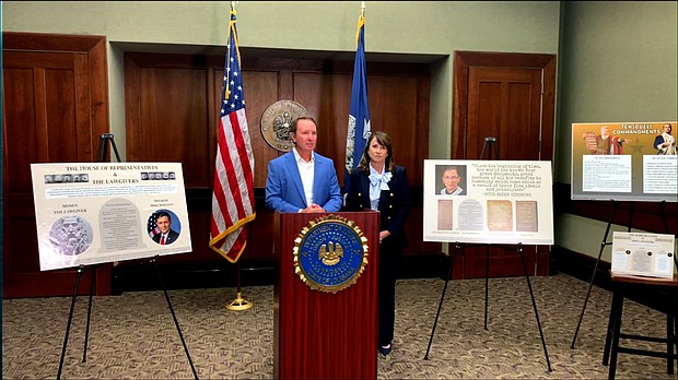 Louisiana Gov. Jeff Landry and Attorney General Liz Murrill presented several posters of the Ten Commandments that could soon be placed in the state’s public school classrooms.
Mandatory Credit:	Baton Rouge PD via CNN Newsource