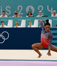 Simone Biles of the United States in action during Monday's floor final at Bercy Arena in Paris.
Mandatory Credit: Mike Blake/Reuters via CNN Newsource