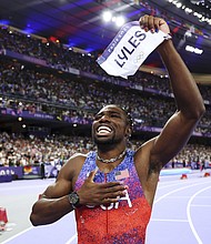 Noah Lyles celebrates winning the gold medal in the men's 100m final on day nine of the 2024 Olympic Games.
Mandatory Credit:	Christian Petersen/Getty Images via CNN Newsource