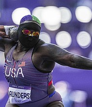 Raven Saunders in action during qualification in the women's shot put at the Paris Olympic Games.
Mandatory Credit:	Michael Kappeler/dpa/AP via CNN Newsource