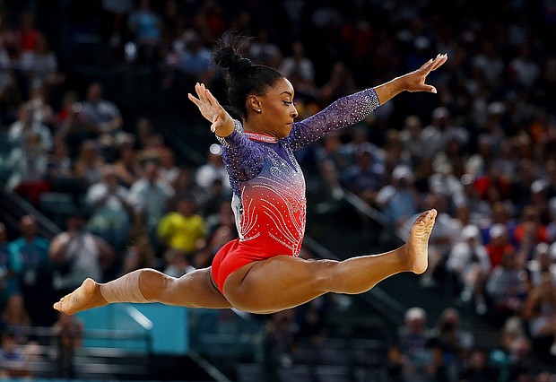 Simone Biles of United States in action.
Mandatory Credit:	Hannah McKay/Reuters via CNN Newsource