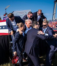Secret Service agents remove former President Donald Trump from the stage in Butler, Pennsylvania, on Saturday, July 13, 2024.
Mandatory Credit:	Jabin Botsford/The Washington Post/Getty Images via CNN Newsource