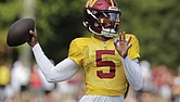 Washington Commanders quarterback Jayden Daniels throws the ball Aug. 4 during a football practice at the team’s training facility in Ashburn, Va