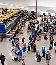 Delta Airlines passengers line up for agent assistance at Hartsfield-Jackson Atlanta International Airport on July 22, 2024.
Mandatory Credit:	Jessica McGowan/Getty Images via CNN Newsource