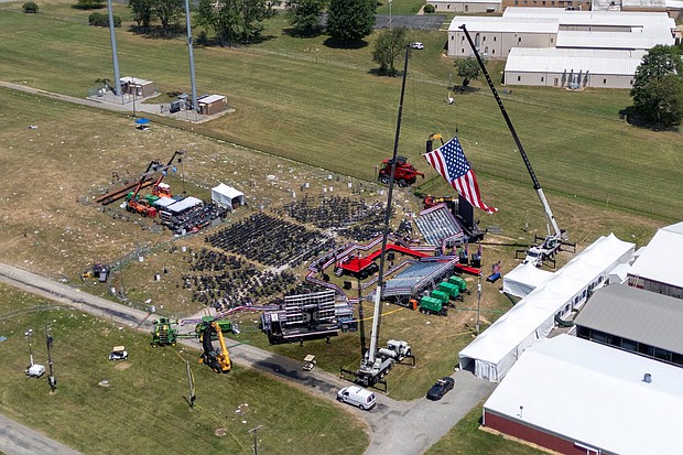 A drone view shows the stage where former President Donald Trump had been standing during an assassination attempt the day before, and the roof of a nearby building where a gunman was shot dead by law enforcement, in Butler, Pennsylvania, on July 14.
Mandatory Credit:	Carlos Osorio/Reuters via CNN Newsource