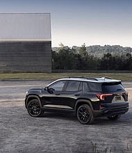 Rear 3/4 view of the next-generation 2025 GMC Terrain Elevation featuring two-tone roof.