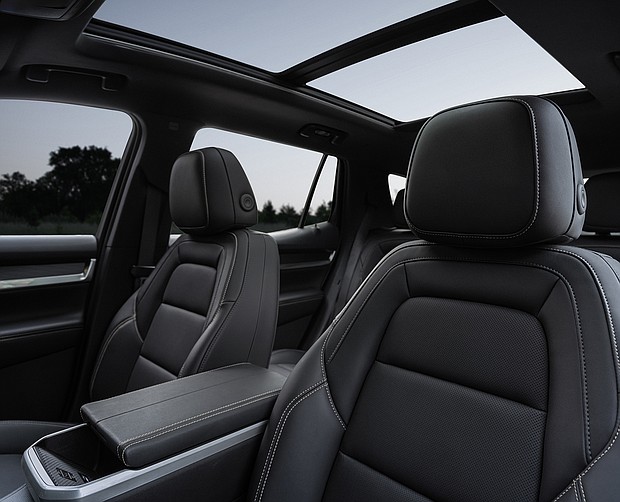 Rear-facing view of the next-generation 2025 GMC Terrain Elevation’s new interior, showing the driver and front passenger seats.