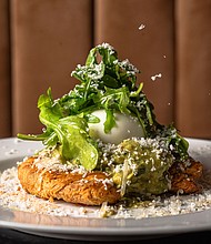 Avocado Crost (Pan-seared croissant, poached egg, parmesan truffle aioli, and arugula)
