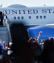 Kamala Harris and Tim Walz exit Air Force Force Two as they arrive at Detroit Metropolitan Wayne County Airport on August 7,
Mandatory Credit:	Adam J. Dewey/Anadolu/Getty Images via CNN Newsource