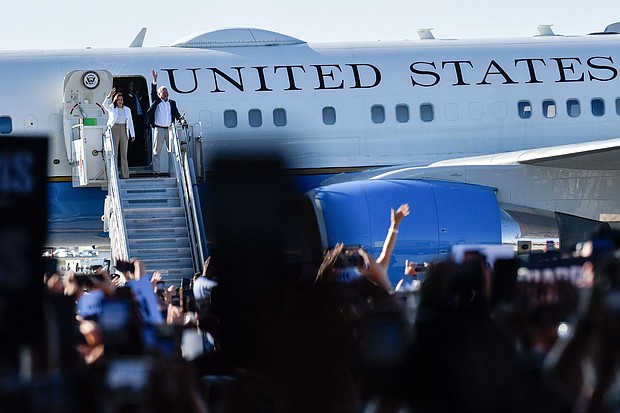 Kamala Harris and Tim Walz exit Air Force Force Two as they arrive at Detroit Metropolitan Wayne County Airport on August 7,
Mandatory Credit:	Adam J. Dewey/Anadolu/Getty Images via CNN Newsource