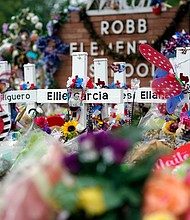 Flowers and other items surround crosses at a memorial for the victims of the shooting at Robb Elementary School in Uvalde, Texas, on June 9, 2022.
Mandatory Credit:	Eric Gay/AP/File via CNN Newsource