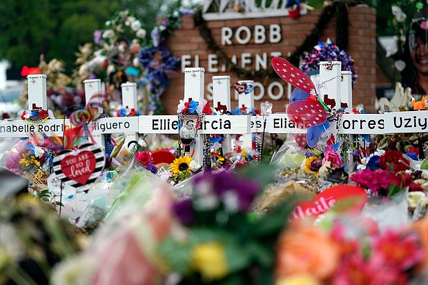 Flowers and other items surround crosses at a memorial for the victims of the shooting at Robb Elementary School in Uvalde, Texas, on June 9, 2022.
Mandatory Credit:	Eric Gay/AP/File via CNN Newsource