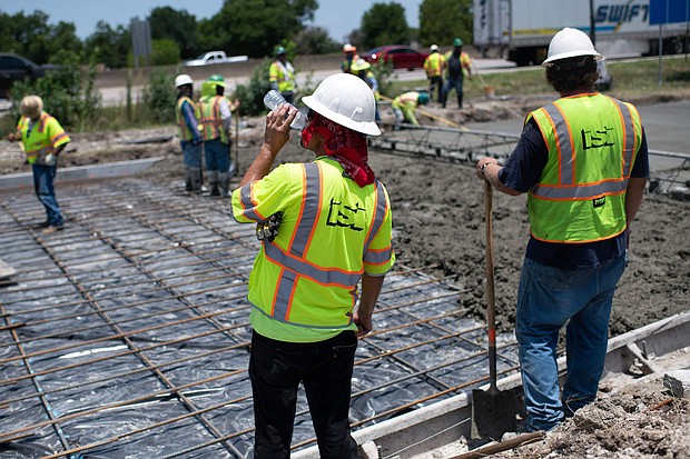 A dangerous and prolonged heat wave blanketed large parts of the southern US on Tuesday, buckling highways and forcing people into air-conditioned shelters as temperatures soared past 115 degrees F, and a construction worker is seen drinking water while repairing a road with heat damage in Houston, Texas on June 27, 2023.
Mandatory Credit:	Mark Felix/AFP/Getty Images via CNN Newsource