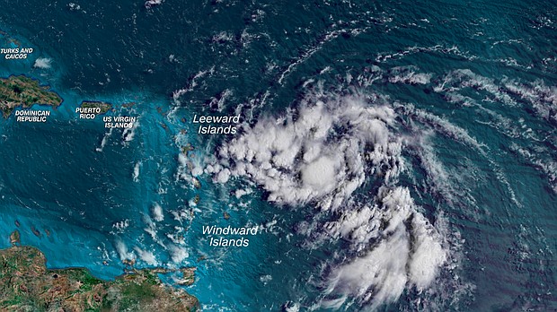 An area of showers and thunderstorms is organizing into the summer's next tropical storm a few hundred miles east of the Caribbean Monday morning.
Mandatory Credit:	CNN Weather via CNN Newsource