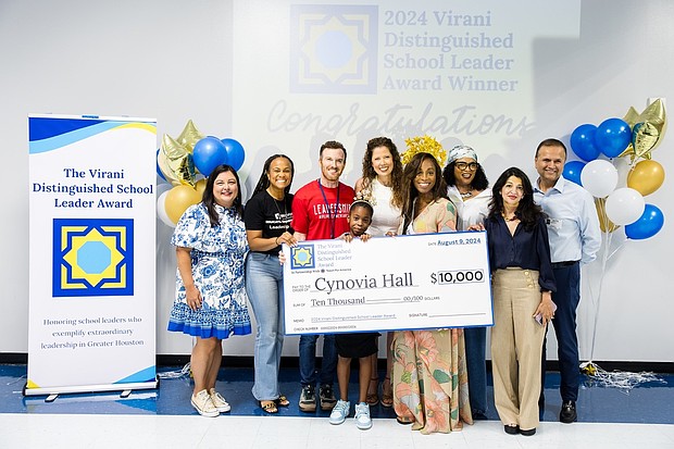 Dr. Asha and Farid Virani present the award check to Cynovia Hall, one of the two 2024 Virani Distinguished School Leader Award winners.
From left to right, top: Tiffany Cuellar Needham (Executive Director, TFA Houston), Danitra Arredondo (Head of Schools, YES Prep), Jared Braun (AP, KIPP Unity), Reagan Fitzpatrick (Cynovia’s daughter), Elizabeth Carlson-Young (Deputy Chief Program Officer, YES Prep), Cynovia Hall (Winner, Virani Distinguished School Leader Award), Judy Pilgrim (Cynovia’s mom), and Dr. Asha and Farid Virani (Founders, Virani Distinguished School Leader Award).