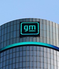 General Motors is the first car manufacturer to be hit with a lawsuit after the attorney general’s office opened an investigation into several manufacturers, and the new GM logo is seen on the General Motors headquarters in Detroit, Michigan, March 16, 2021.
Mandatory Credit:	Rebecca Cook/Reuters via CNN Newsource