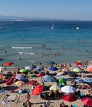Santa Teresa di Gallura in Sardinia is among Italian destinations imposing new rules on its beaches as huge numbers of tourists are expected to descend.
Mandatory Credit:	Emanuele Perrone/Getty Images via CNN Newsource